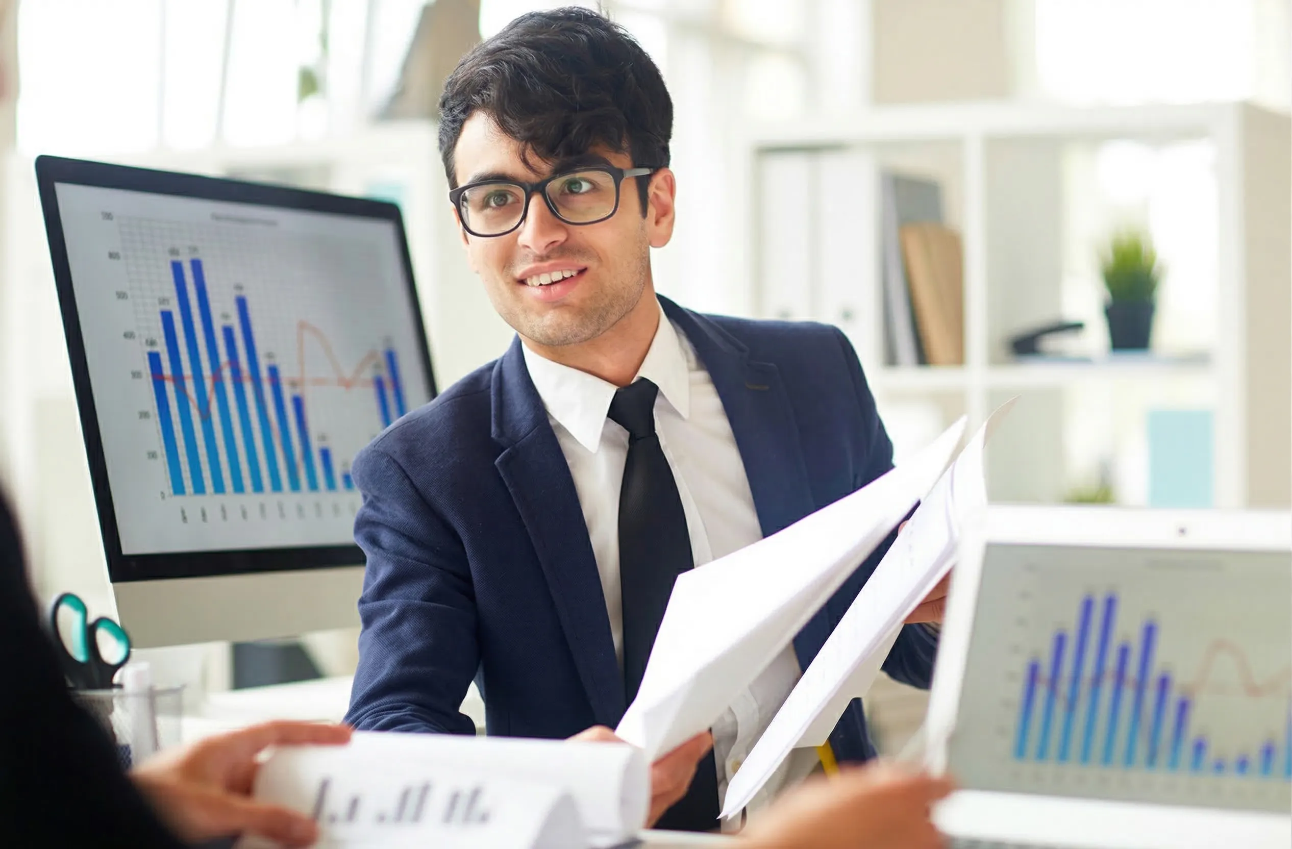 Analyst studying stock charts and market data